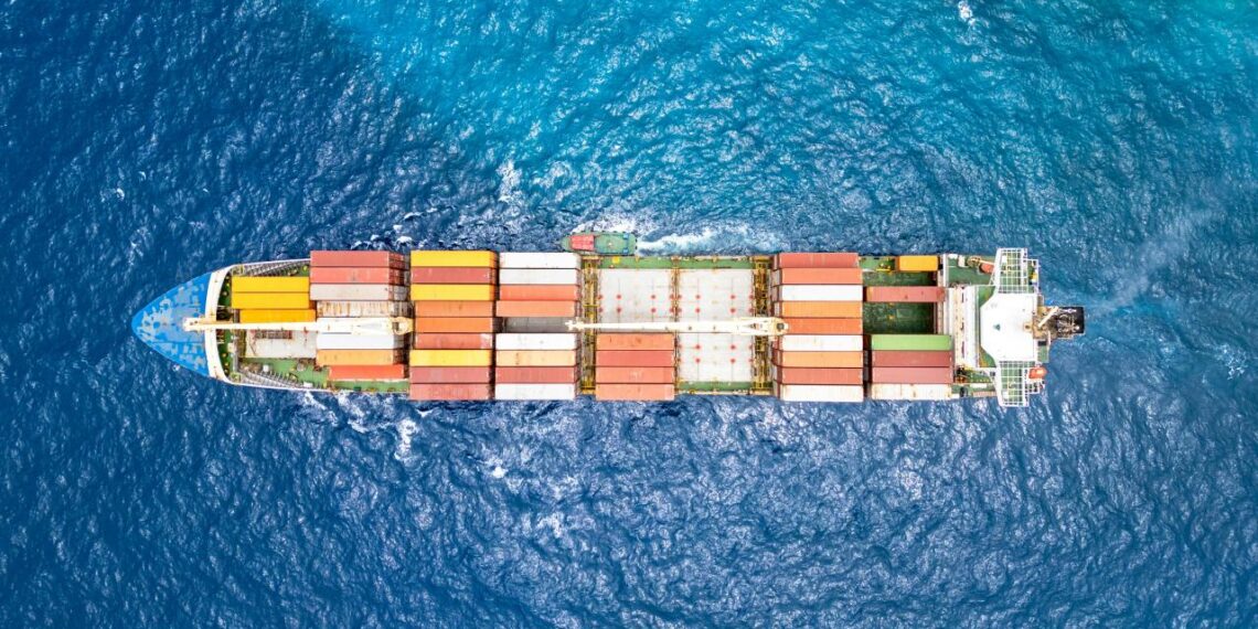 An aerial view of a cargo ship in the ocean